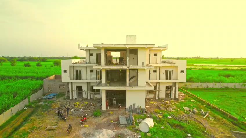 Aerial view of Vrajraj Farms surrounded by green fields at Punchhari, Govardhan